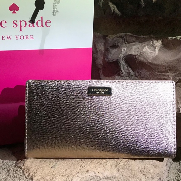 kate spade Handbags - Kate Spade Rose Gold Leather Medium slim Wallet